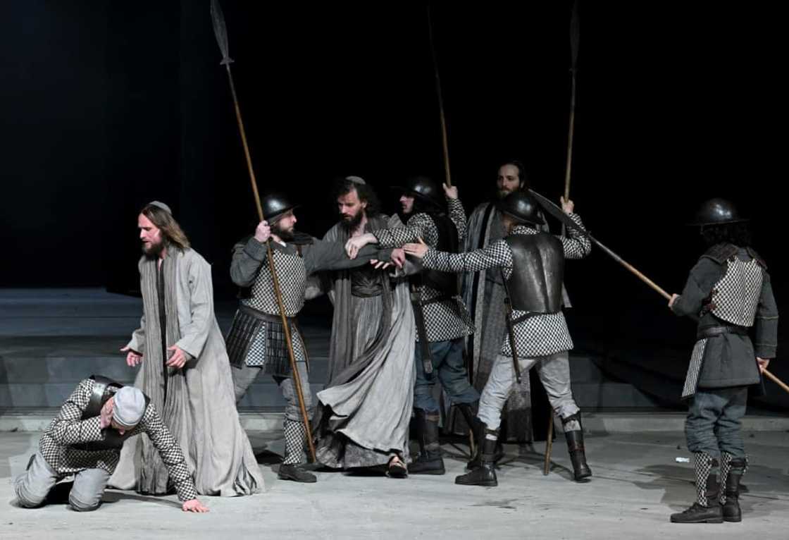 The play's themes of violence, poverty and sickness are reflected in today's world through the war in Ukraine and Covid, says Frederik Mayet (2ndL) who plays Jesus The play's themes of violence, poverty and sickness are reflected in today's world through the war in Ukraine and Covid, says Frederik Mayet (2ndL) who plays Jesus