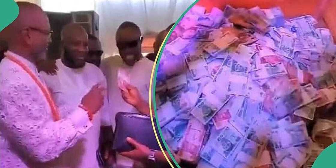 Igbo men fill big box with wads of cash at event Igbo men fill big box with wads of cash at event