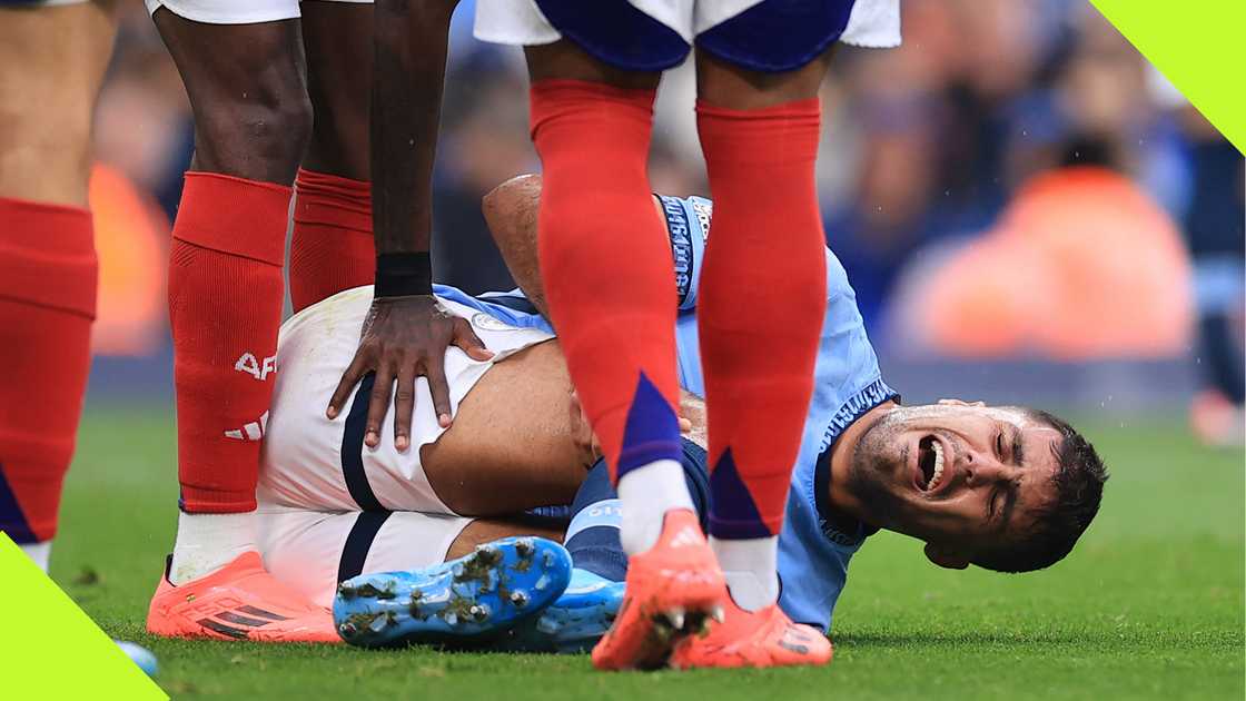 Rodri screams in pain after injuring his knee during Manchester City's 2-2 draw against Arsenal. Rodri screams in pain after injuring his knee during Manchester City's 2-2 draw against Arsenal.