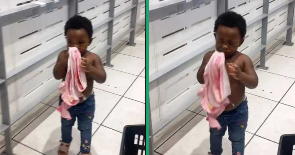 A little girl did not want to take her new clothes off in the shop