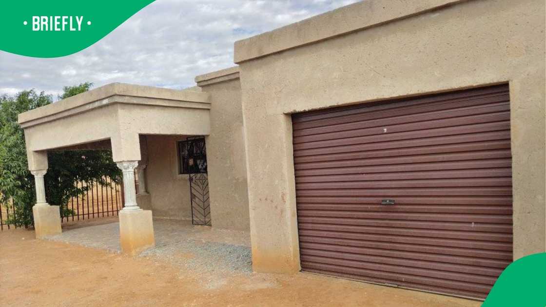 A South African woman showed her home's exterior. A South African woman showed her home's exterior.