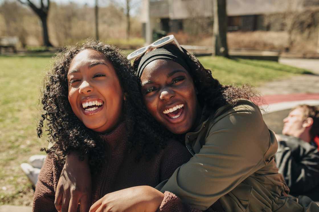 Two friends are hugging Two friends are hugging