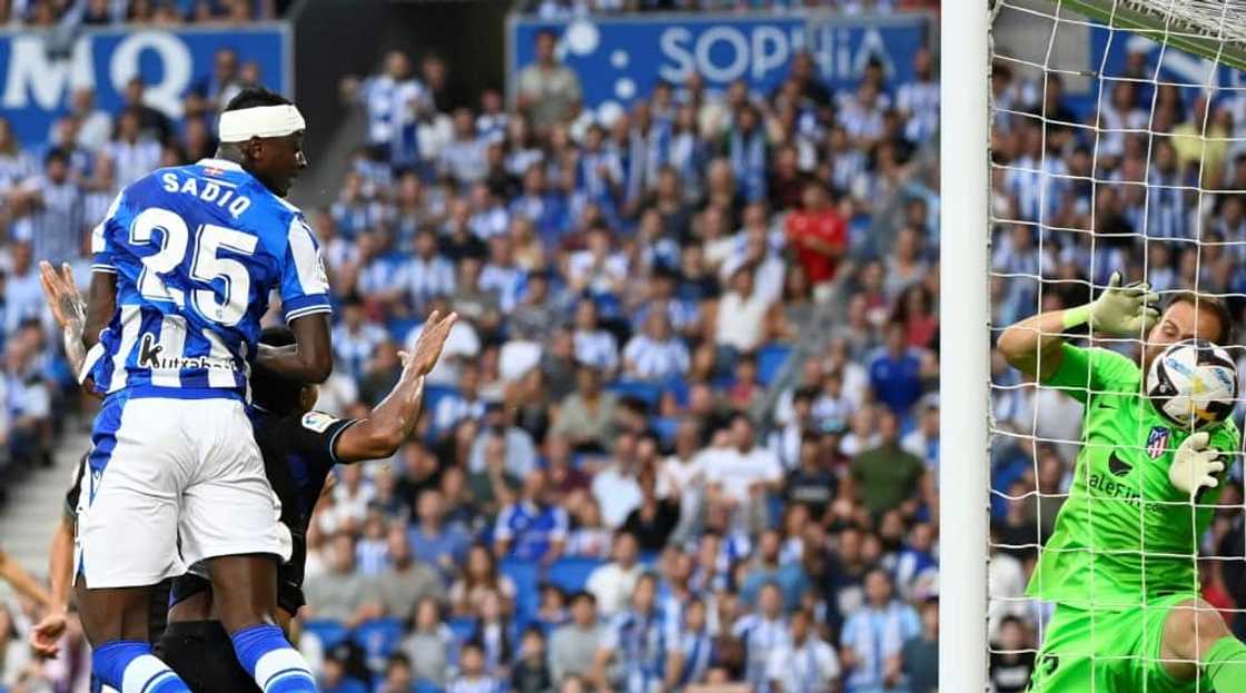 Umar Sadiq (L) equalises for Real Sociedad against Atletico Madrid.