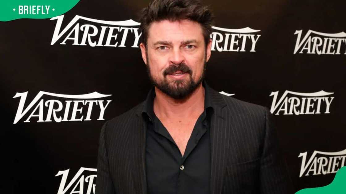 Karl Urban posing for a photo at the Variety Studio in 2022 Karl Urban posing for a photo at the Variety Studio in 2022