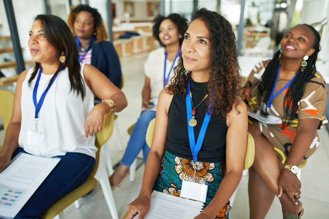 Women attending a workshop. Women attending a workshop.