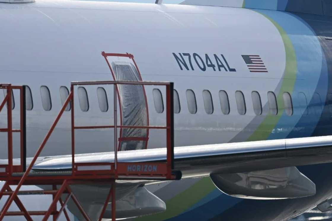 The missing emergency door of Alaska Airlines N704AL, which made an emergency landing at Portland International Airport is covered and taped, in Portland, Oregon on January 23, 2024 The missing emergency door of Alaska Airlines N704AL, which made an emergency landing at Portland International Airport is covered and taped, in Portland, Oregon on January 23, 2024