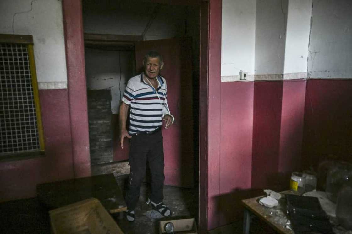 Mykhailo Chindey's injured arm is encased in plaster, a painful reminder of Russia's occupation Mykhailo Chindey's injured arm is encased in plaster, a painful reminder of Russia's occupation