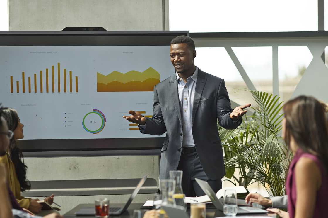 A man giving a presentation A man giving a presentation