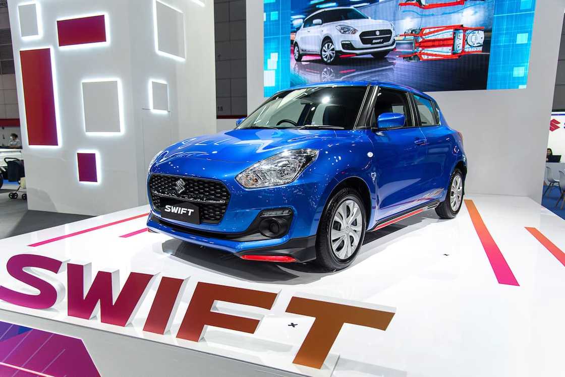 A blue Suzuki Swift