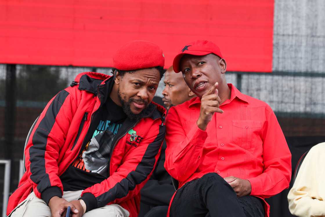 Dr Mbuyiseni Ndlozi chatting with EFF Leader Julius Malema