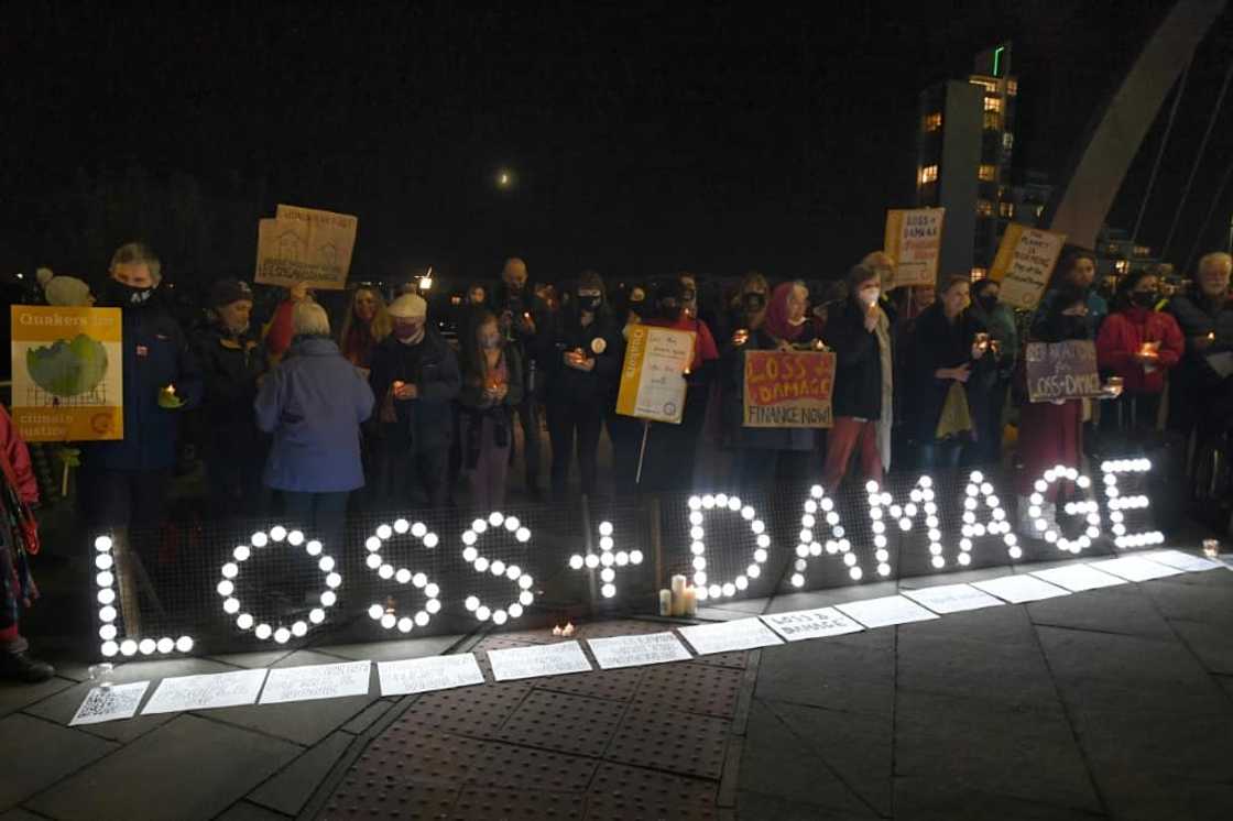 Climate activists holding a vigil for people around the world experiencing the most severe climate impacts during the UN COP26 conference in Glasgow Climate activists holding a vigil for people around the world experiencing the most severe climate impacts during the UN COP26 conference in Glasgow