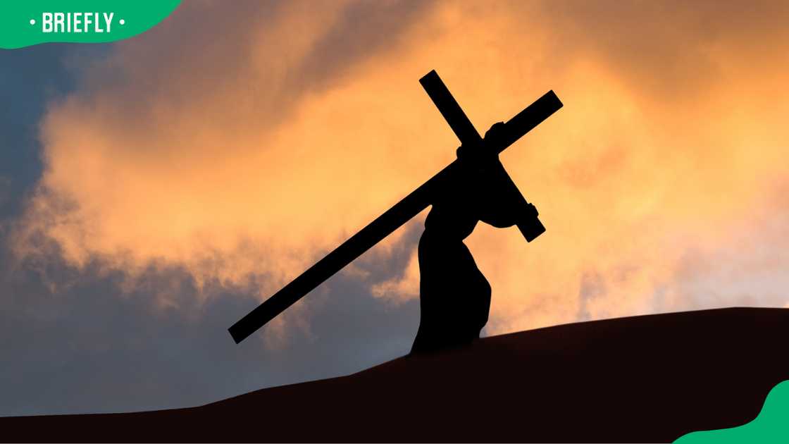 Christ carrying the Cross on Good Friday with a dramatic sky in the background. Christ carrying the Cross on Good Friday with a dramatic sky in the background.