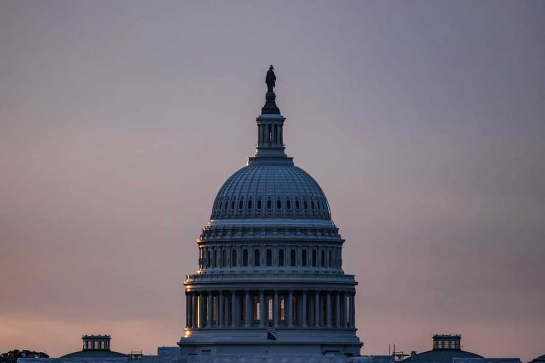 Fitch's decision to cut the US debt rating follows the long-running standoff on Capitol Hill earlier this year that saw the world's top economy flirt with a possible default, which rattled markets Fitch's decision to cut the US debt rating follows the long-running standoff on Capitol Hill earlier this year that saw the world's top economy flirt with a possible default, which rattled markets