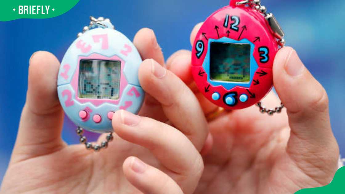 Children show their "Tamagotchi" electronic pet Children show their "Tamagotchi" electronic pet