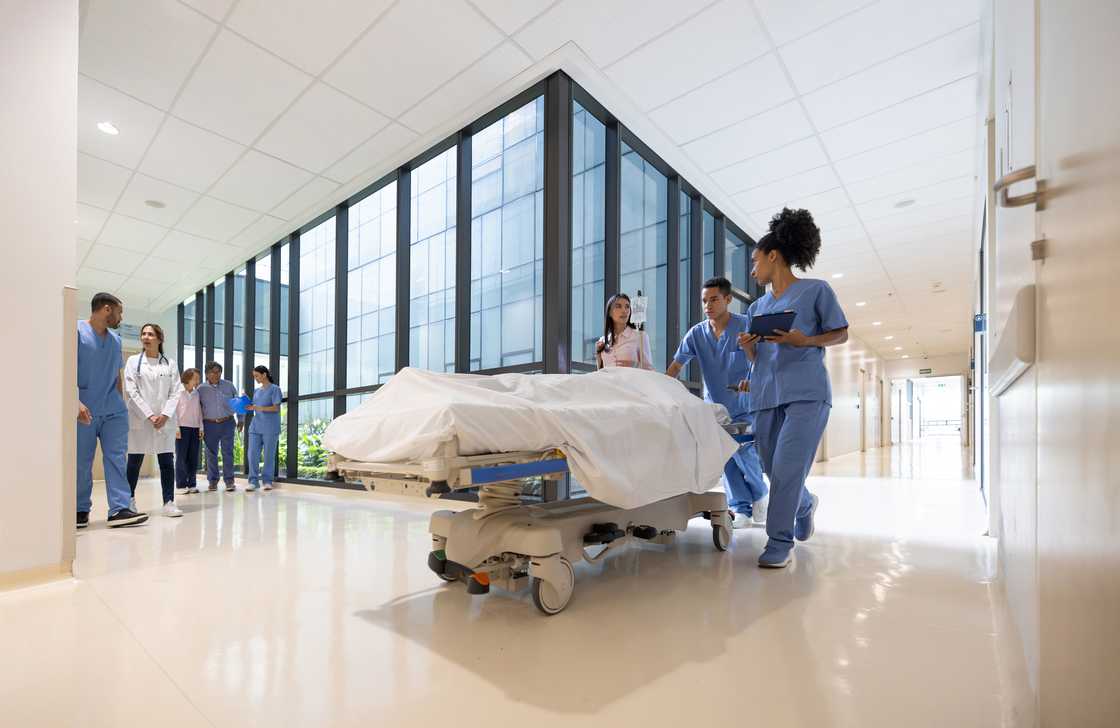 A patient is being taken to the ward