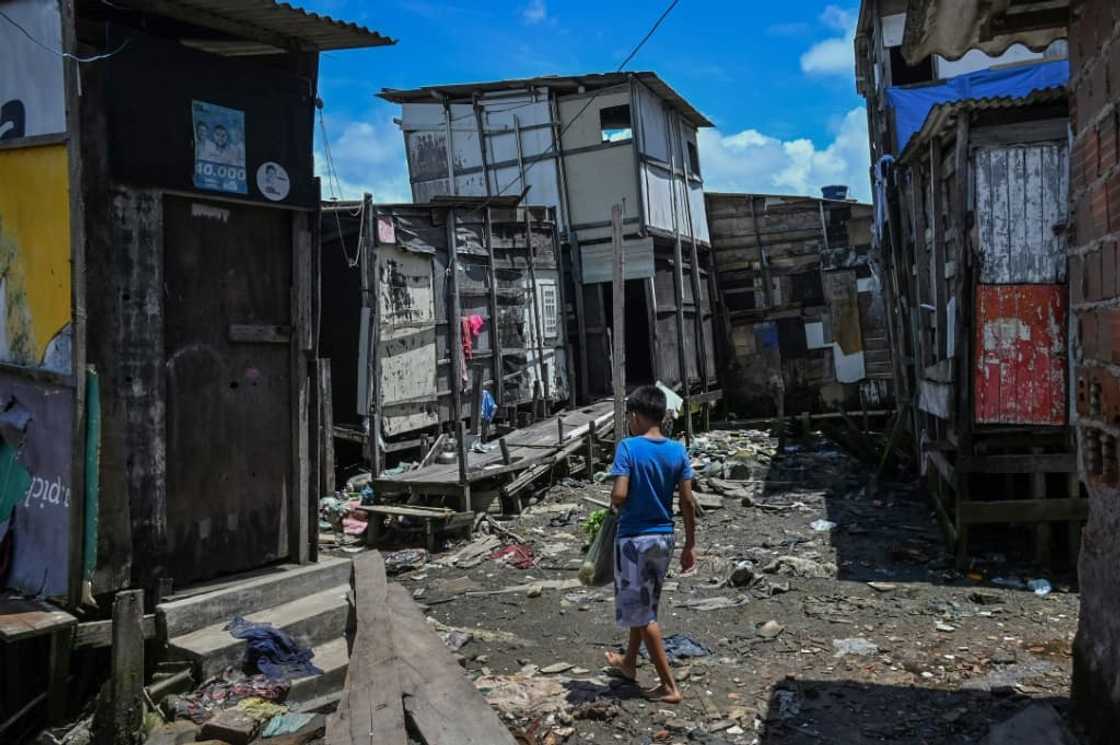 Children are among the worst affected by extreme poverty, which is rising across Latin America and the Caribbean. Here, a child walks through a favela in northeastern Brazil. Children are among the worst affected by extreme poverty, which is rising across Latin America and the Caribbean. Here, a child walks through a favela in northeastern Brazil.