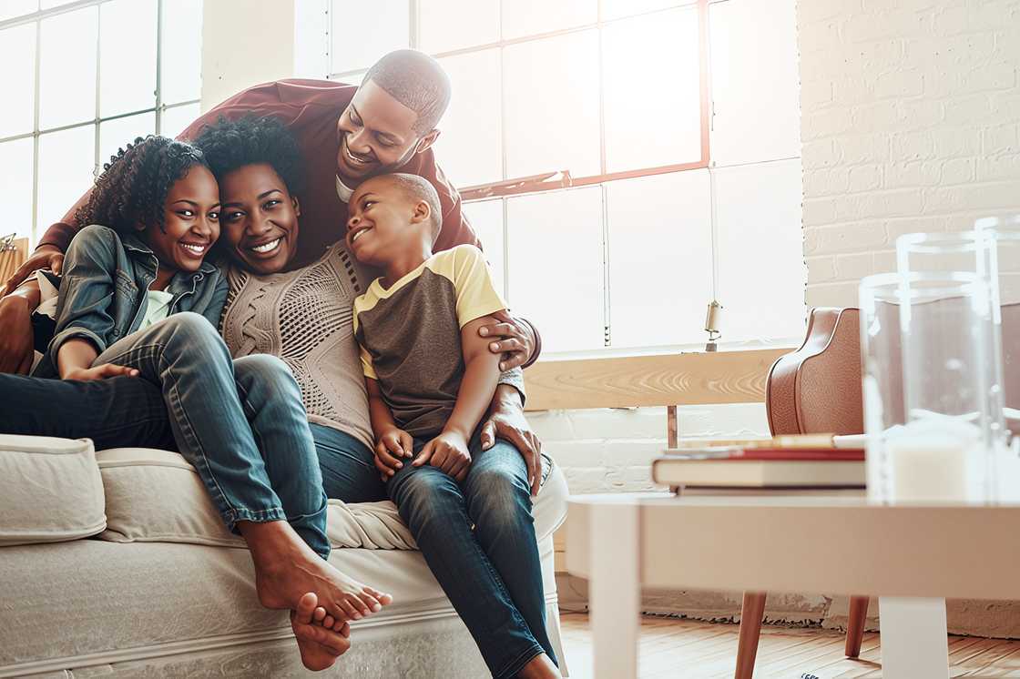 A black family on the sofa in their home