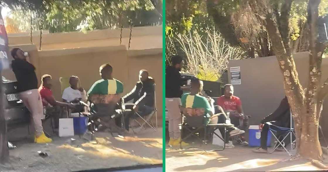 Johannesburg men chill next to crashed BMW. Johannesburg men chill next to crashed BMW.