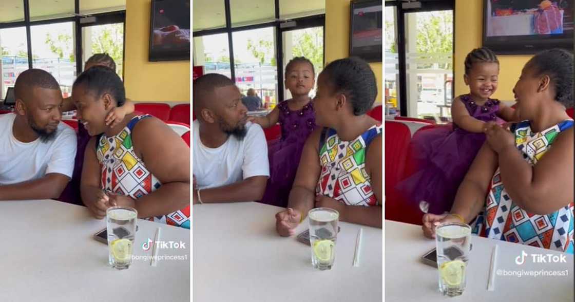 Cute girl getting her parents to kiss Cute girl getting her parents to kiss