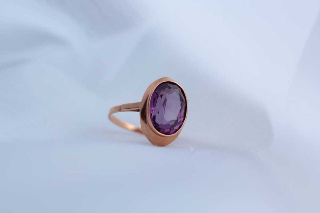 Closeup of gold ring with amethyst gemstone. Closeup of gold ring with amethyst gemstone.