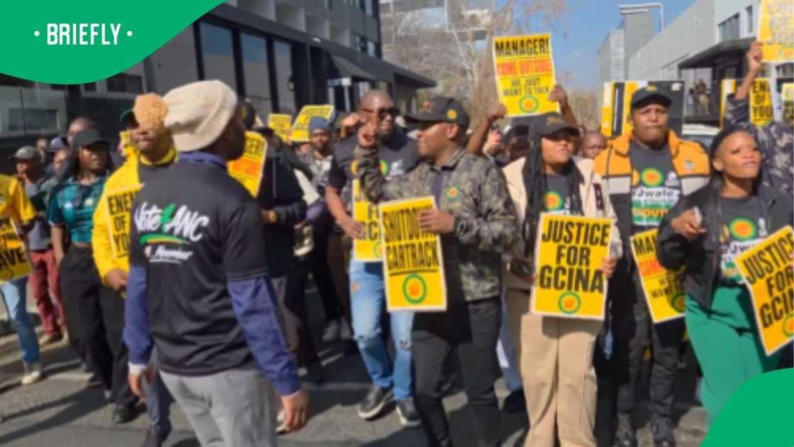 Protesters carrying placards demanding justice and calling for a shutdown marched together in an organized public demonstration Protesters carrying placards demanding justice and calling for a shutdown marched together in an organized public demonstration