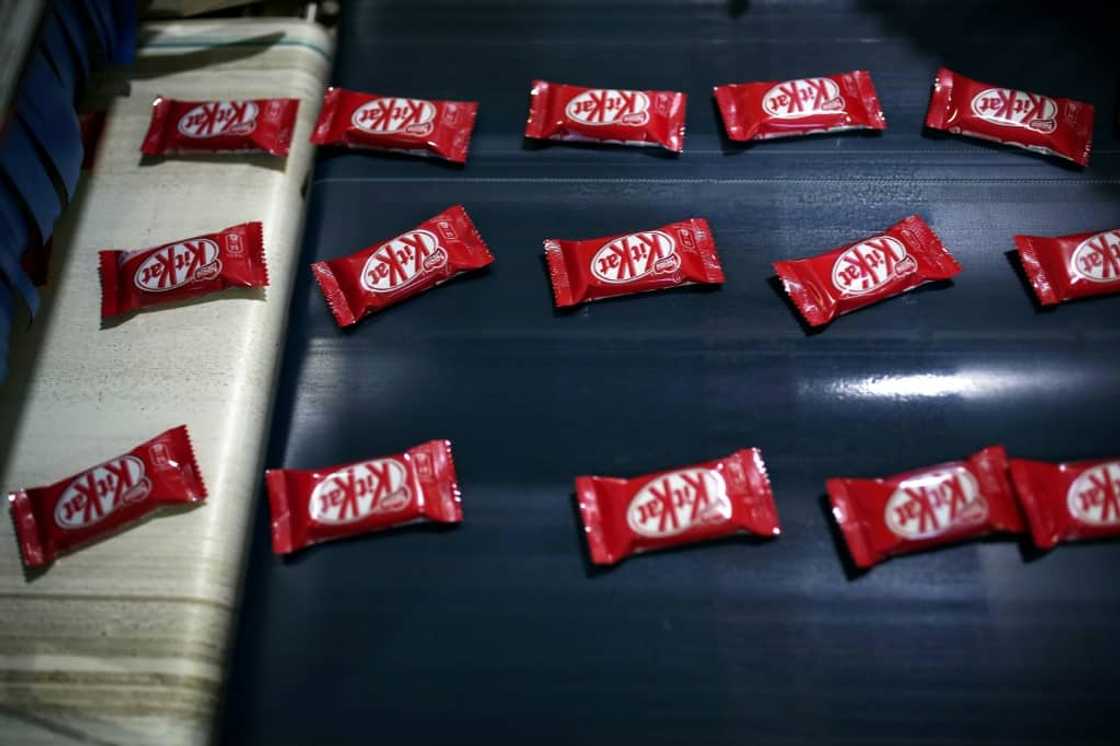 Inflation cut profit margins of Nestle, which makes KitKats and many other food products Inflation cut profit margins of Nestle, which makes KitKats and many other food products