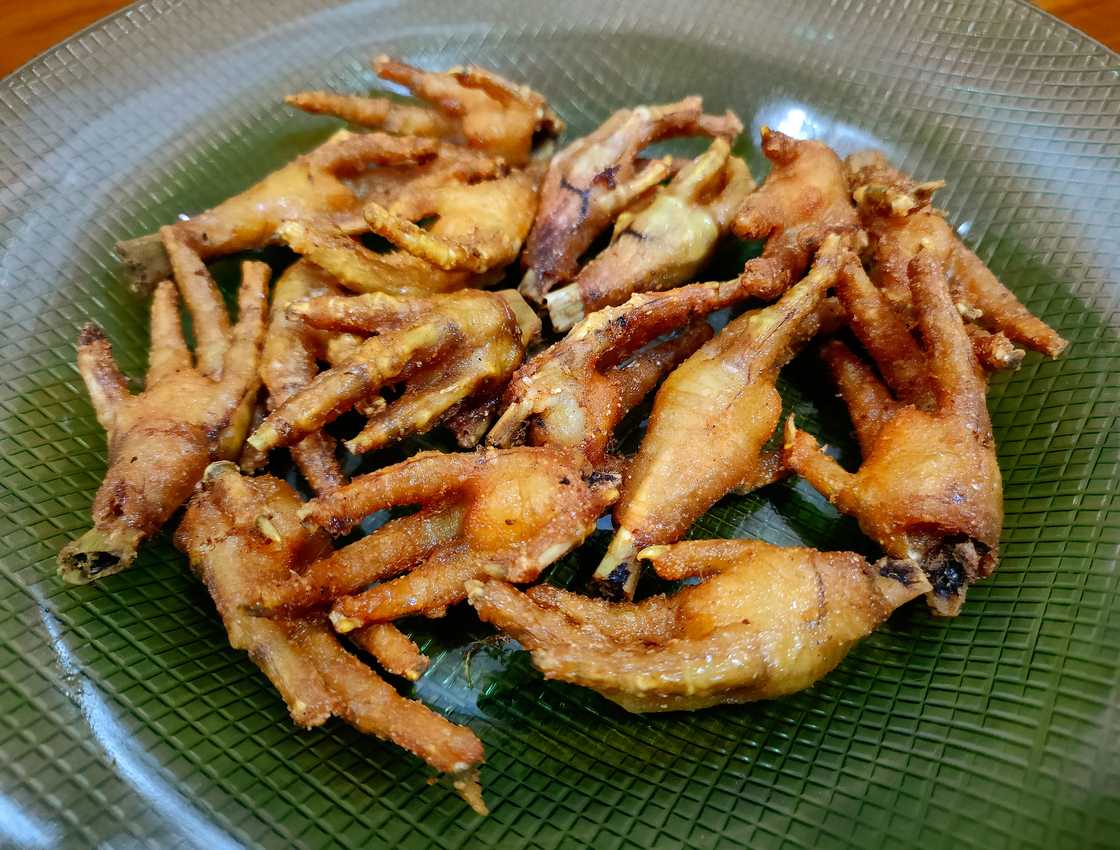 Deep-fried chicken feet. Deep-fried chicken feet.