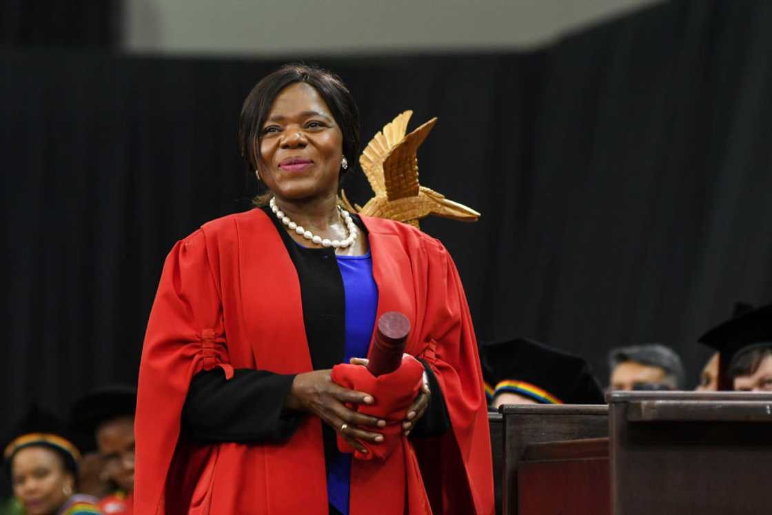Thuli Madonsela wearing a red and black graduation gown to receive an Honorary Doctorate at the University of KwaZulu-Natal Thuli Madonsela wearing a red and black graduation gown to receive an Honorary Doctorate at the University of KwaZulu-Natal