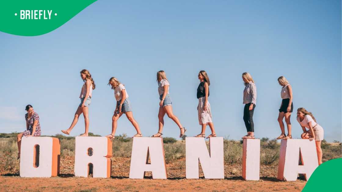 The visual showed women posing on top of the Orania sign The visual showed women posing on top of the Orania sign