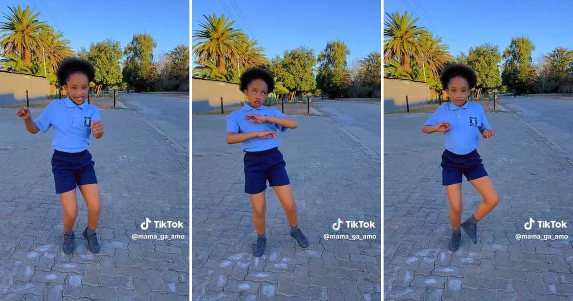 A young girl busted vibey dance moves in school uniform