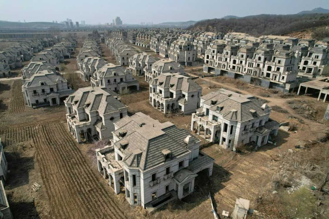 A luxury complex in Shenyang whose crumbling verandas and overgrown arches are stark symbols of a housing market in China crippled by its own excess A luxury complex in Shenyang whose crumbling verandas and overgrown arches are stark symbols of a housing market in China crippled by its own excess