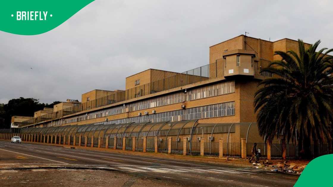 A picture taken on September 30, 2021 shows a lone vehicle driving past the Kgosi Mampuru Correctional Services that was barricaded by protesting African National Congress (ANC) Ward 80 municipal community members from Salvokop in Pretoria