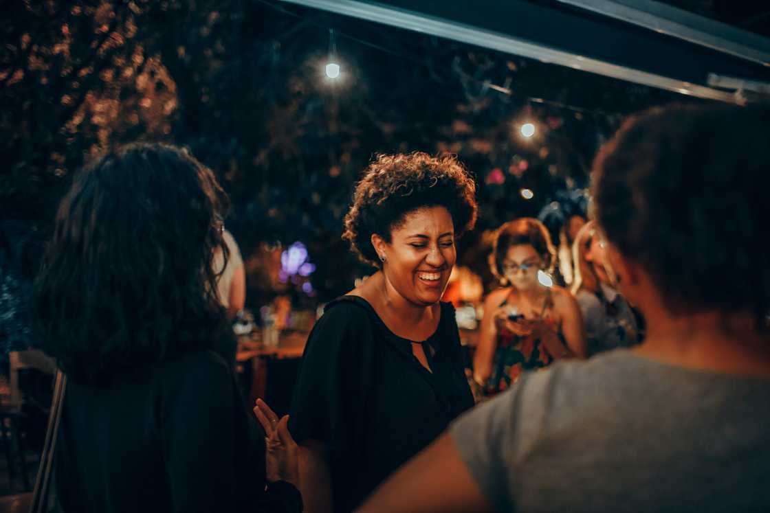 A group of women laughing in a club