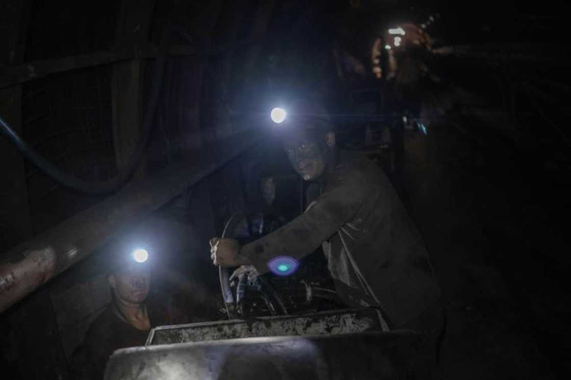 The heat is smothering in the shafts and the air is saturated with percolating dust The heat is smothering in the shafts and the air is saturated with percolating dust
