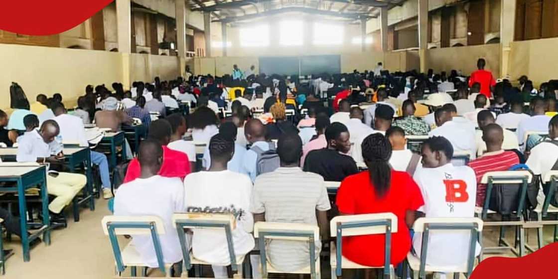 University students sit in class listening to a lecture. University students sit in class listening to a lecture.