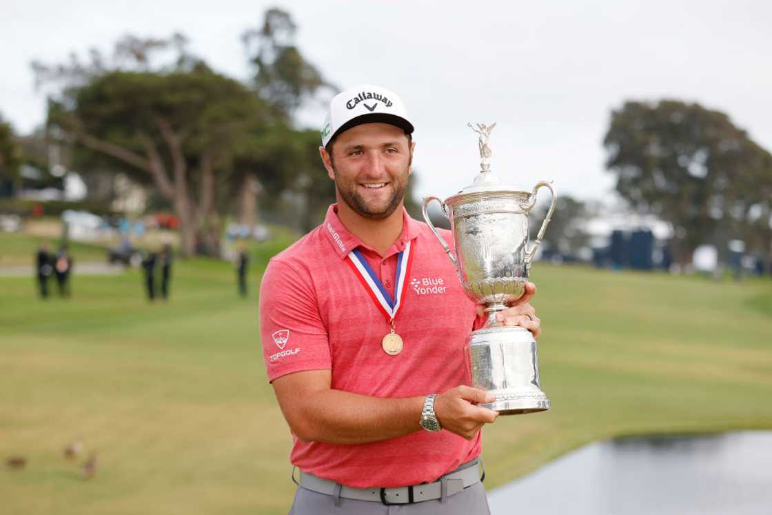 Jon Rahm with a trophy after winning during the final round of a U.S. Open