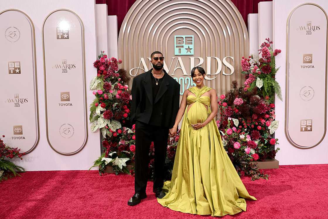 Skyh Black and KJ Smith touches her baby bumpy at the read carpet of the BET 2025 awards