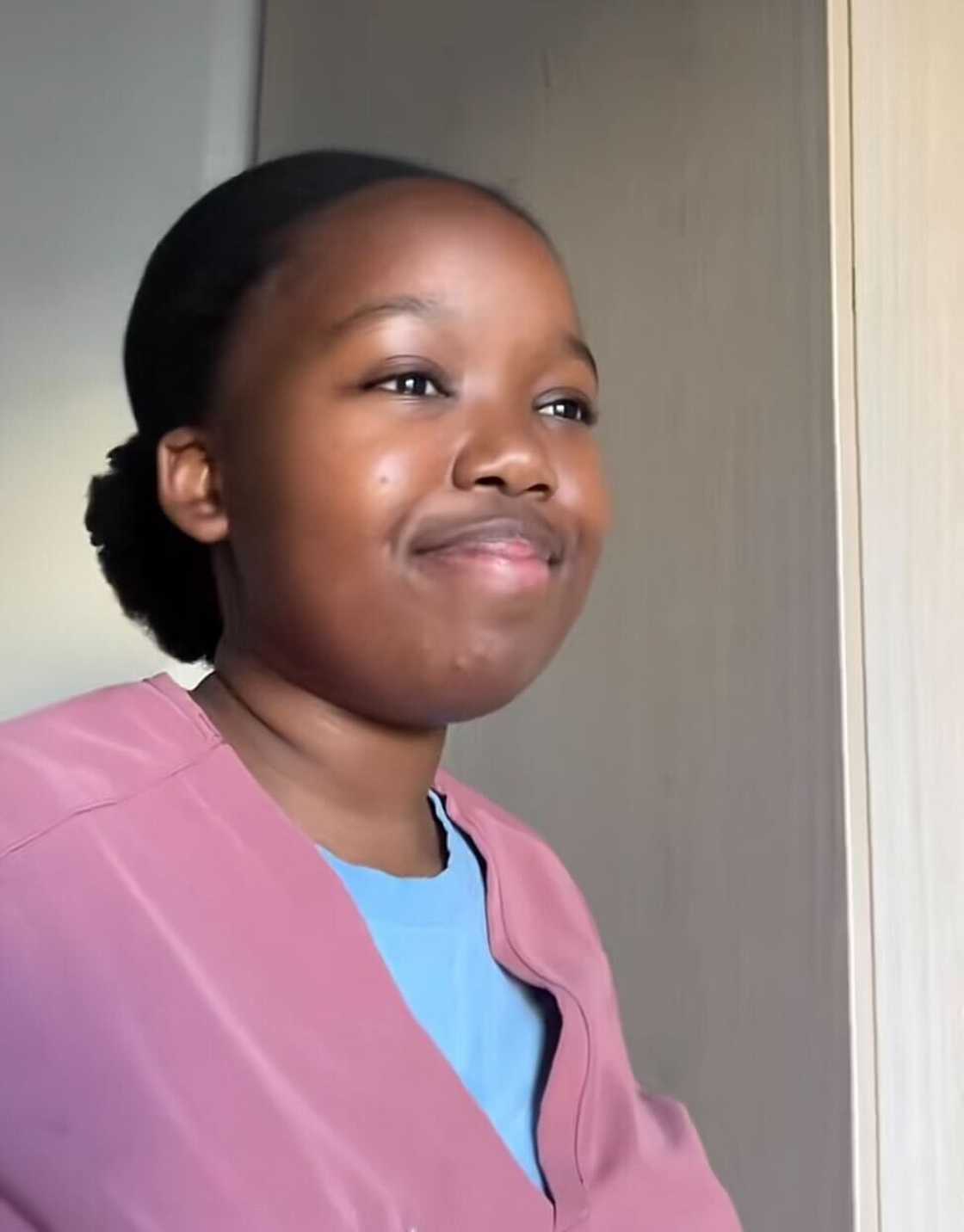 A woman showcased her hair in a TikTok video, sharing her content with viewers.