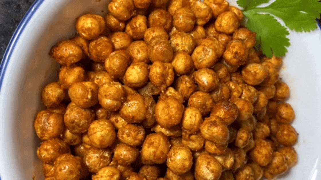 Preparing loaded hummus with crunchy chickpeas Preparing loaded hummus with crunchy chickpeas