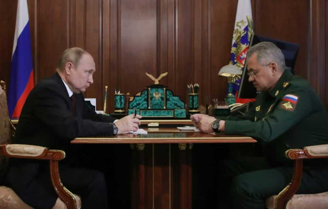 Russian President Vladimir Putin sits with  Defence Minister Sergei Shoigu at the Kremlin Russian President Vladimir Putin sits with  Defence Minister Sergei Shoigu at the Kremlin