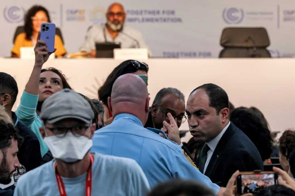 Egyptian MP Amr Darwish is escorted out by United Nations security during a press conference hosted by the Global Campaign to Demand Climate Justice and attended by Sanaa Seif, sister of imprisoned British-Egyptian activist Alaa Abdel Fattah Egyptian MP Amr Darwish is escorted out by United Nations security during a press conference hosted by the Global Campaign to Demand Climate Justice and attended by Sanaa Seif, sister of imprisoned British-Egyptian activist Alaa Abdel Fattah