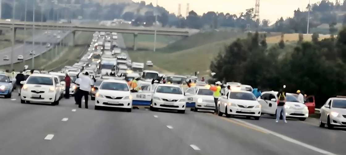E hailers in Joburg protest with body of slain driver as they call for safety reform E hailers in Joburg protest with body of slain driver as they call for safety reform