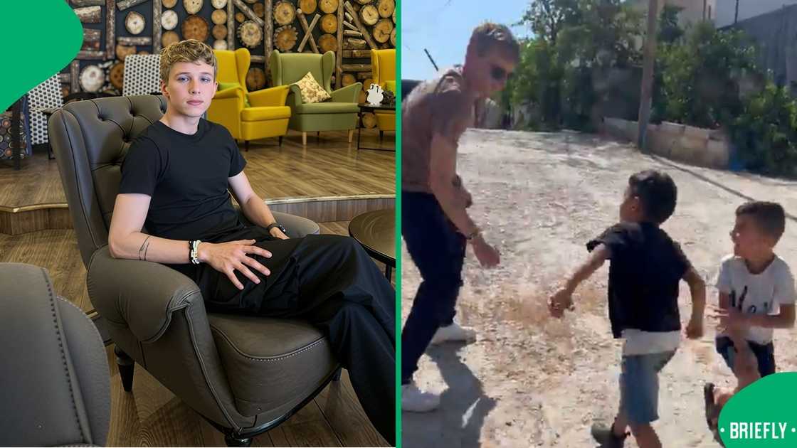 In the video, the young man was playing with three kids who looked happy despite what was happening in their country