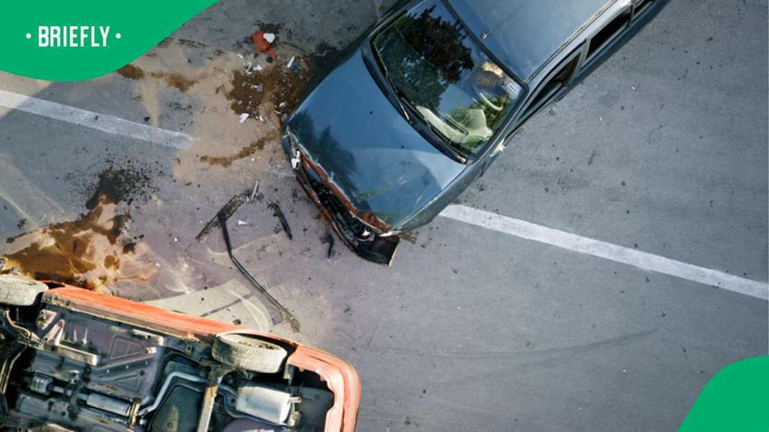 Two cars collided on a road during a fatal accident. Two cars collided on a road during a fatal accident.