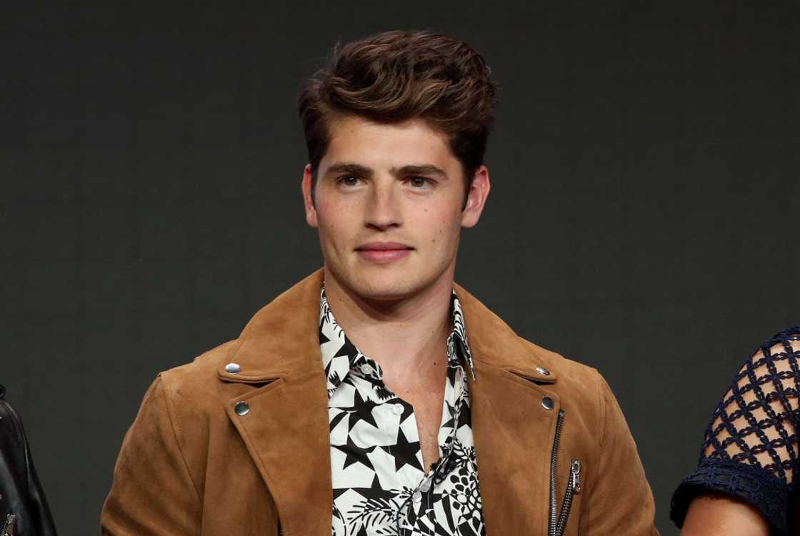 Gregg Sulkin smiling