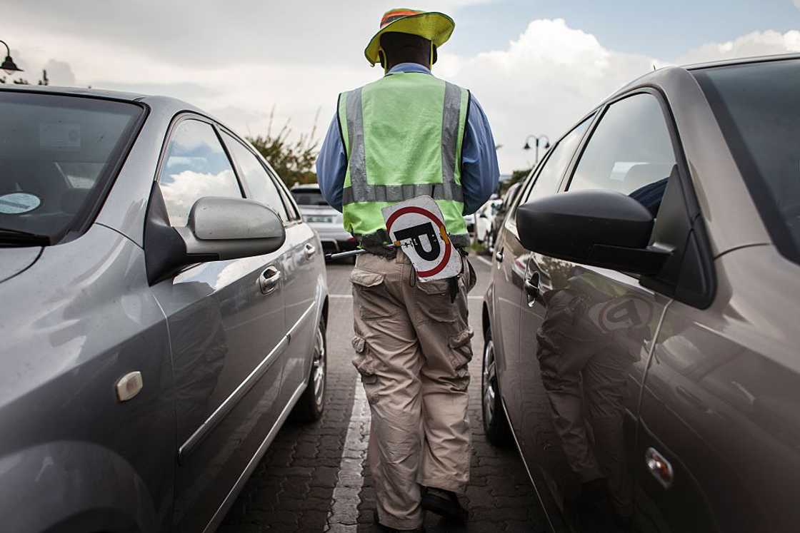 A South African car guard. A South African car guard.