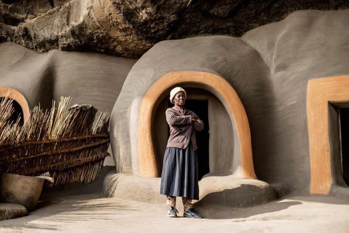 The cave is divided into several round houses propped against the basalt rock The cave is divided into several round houses propped against the basalt rock