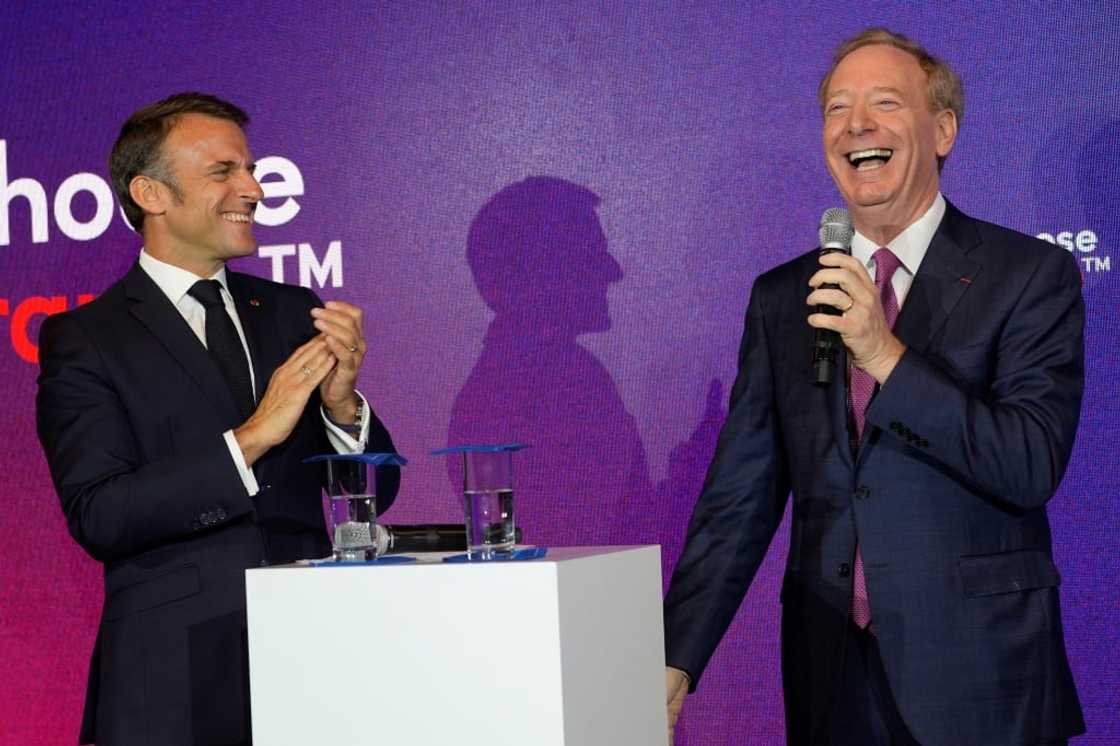 French President Emmanuel Macron with Microsoft CEO Brad Smith, whose company announced four billion euros in investment in France