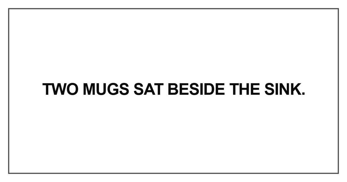 Two mugs sat beside the sink
