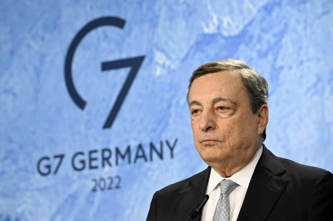 Italy's Prime Minister Mario Draghi insisted that "we don't want to go back on our (climate) commitments," but added the current energy upheaval was "an emergency"